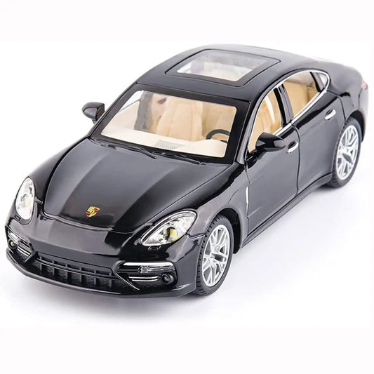 Svart fyrdörrars sportbil i modellformat, sned framifrån mot vit bakgrund