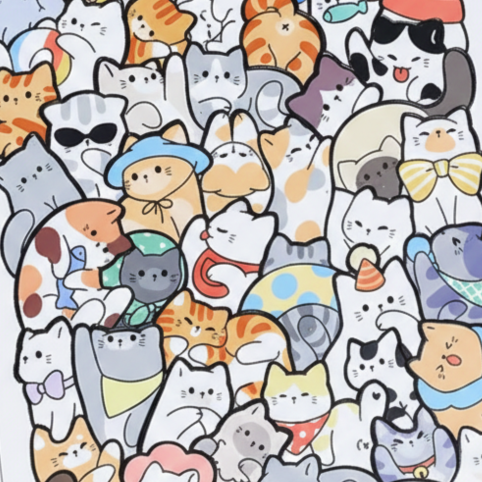 Närbild av träpussel med många tecknade katter