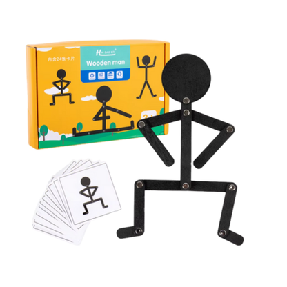 Svart trämänniska med poseringskort och förpackning mot vit bakgrund