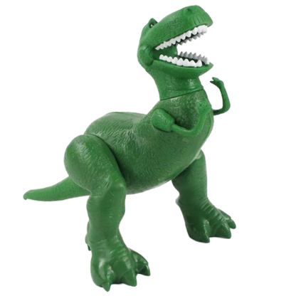 Grön dinosaurieleksak stående mot vit bakgrund